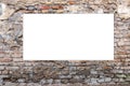 Mock up. Blank vertical billboard, poster frame, advertising on old brick wall. Royalty Free Stock Photo