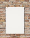 Mock up blank white hanging poster with clothespin and rope on brick wall, background