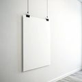 Mock up blank white hanging poster on white wall background Royalty Free Stock Photo