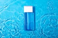 Mock up blue miccelar water, moisturizing in water on blue background. Template for design Blank label for branding mock-up.