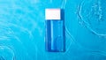 Mock up blue miccelar water, moisturizing in water on blue background. Template for design Blank label for branding mock-up.