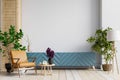 Mock up cabinet in modern living room with leather armchair and plant on white wall background