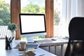 Computer with empty display on white table in modern office. Royalty Free Stock Photo