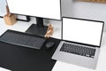 Computer pc and laptop on white desk in home office interior. Royalty Free Stock Photo