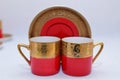 Mock up / design set of elegant and traditional colorful Red and gold traditional elegant coffee cup & Tea cup on cup`s plate besi Royalty Free Stock Photo