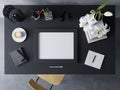 Mock up design template to showcase artwork of empty poster in modern workspace in horizontal frame resting on a black table