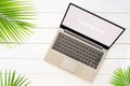 Mock up display of laptop on white wooden table for Summer Holiday background concept. Flat lay top view of Notebook Laptop and Royalty Free Stock Photo