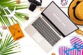 Mock up display of laptop on white wooden table for Summer Holiday Vacation background concept. Flat lay top view of Notebook Royalty Free Stock Photo