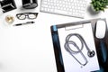 Mock up of doctors desktop with stethoscope and medical supplies.Top view Royalty Free Stock Photo