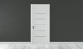 Mock up door on empty room black wall on white wooden floor.3D rendering Royalty Free Stock Photo