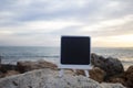 Mock up easel with a chalk board against the background of the sea and reef, for tourist notes on island Palma de