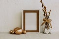 Mock Up Easter. Gold eggs and frame on Linen