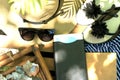 Mock up with electronic book, sunglasses and hat - outdoor summer touristic concept