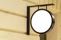 Mock up. Empty round signboard on classical architecture building. Royalty Free Stock Photo