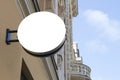 Mock up. Empty round signboard on classical architecture building. Royalty Free Stock Photo