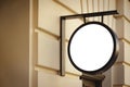 Mock up. Empty white round signboard on the wall of classical architecture building in city Royalty Free Stock Photo