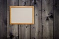 Mock up empty wooden picture frame on dark pine wood wall background, show text Royalty Free Stock Photo