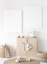 Mock up frame in children room with natural wooden furniture, two vertical frames on white wall