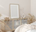 Mock up frame in home interior background, beige room with natural wooden furniture, Scandi-Boho style Royalty Free Stock Photo
