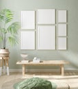 Mock up frame in home interior background, pastel green room with natural wooden furniture Royalty Free Stock Photo