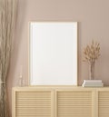 Mock up frame in home interior background, warm beige room with natural wooden furniture, Scandinavian style Royalty Free Stock Photo