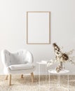 Mock up frame in home interior background, white room with natural wooden furniture, Scandi-Boho style Royalty Free Stock Photo