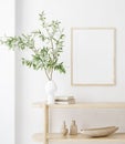 Mock up frame in home interior background, white room with natural wooden furniture, Scandi-Boho style Royalty Free Stock Photo