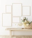 Mock up frame in home interior background, white room with natural wooden furniture, Scandi-Boho style Royalty Free Stock Photo