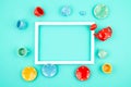 Mock up frame with miniature tea set over light mint background. Top view, flat lay Royalty Free Stock Photo