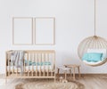 Mock up frame in nursery newborn bedroom, wooden crib in Scandinavian interior design