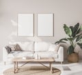 Mock up frame poster in Scandinavian living room with beige sofa Royalty Free Stock Photo
