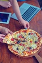 Mock up freelancer workplace. Tablet PC, cell phone and pizza. Top view image. Fast pizza delivery