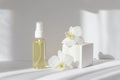 Mock-up of glass bottle with essential oil and 3d podium with orchid flowers, on white background, in rays of sunlight Royalty Free Stock Photo