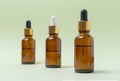 Mock up glass cosmetic brown bottles with a pipette on a mint background