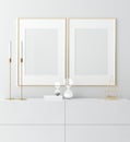 Mock up golden frame in white interior with simple modern decor, Scandinavian style Royalty Free Stock Photo