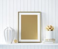 Mock up golden poster frame in interior background with decor