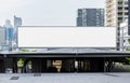 Mock up hanging white rectangle billboard at skytrain station Royalty Free Stock Photo
