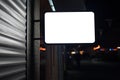 Mock up of illuminated blank signboard in night city. Royalty Free Stock Photo