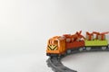 Mock up kids toys composition with colorful toy train with gifts on railway on white background. Royalty Free Stock Photo