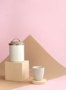 Mock up with kitchen jar on cube podium and ceramic mug on circle shape on pastel background. Minimal concept Royalty Free Stock Photo
