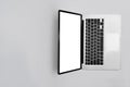 Mock up laptop computer with empty display on white background. Top view with copy space Royalty Free Stock Photo