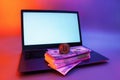 Mock up laptop with white screen and cryptocurrency Bitcoin, dollars and euros against a background of colorful bright neon UV Royalty Free Stock Photo