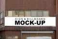 Mock up large outdoor billboard on brick wall of building Royalty Free Stock Photo