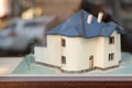 Mock up or layout of two-storey house with blue roof and small courtyard around. Model cottage Royalty Free Stock Photo