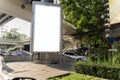 Mock up of light box in a city near traffic jam. Blank banner at dusk for advertising. Blank place for your advertising Royalty Free Stock Photo