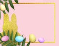 Mock up luxury Easter composition with golden frame, colorful eggs, glitter bunny cutout, green leaves on pink background. Royalty Free Stock Photo