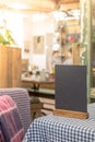 Mock up Menu frame standing on table in Bar restaurant cafe. Royalty Free Stock Photo