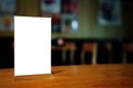 Mock up Menu frame standing on wood table in Bar restaurant cafe. space for text Royalty Free Stock Photo