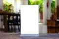 Mock up Menu frame standing on wood table in Bar restaurant cafe Royalty Free Stock Photo