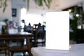 Mock up Menu frame standing on wood table in Bar restaurant cafe Royalty Free Stock Photo